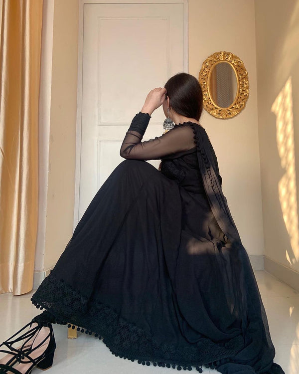 pure georgette Anarkali suit of huge flair with fancy Net and pompom Lace Border